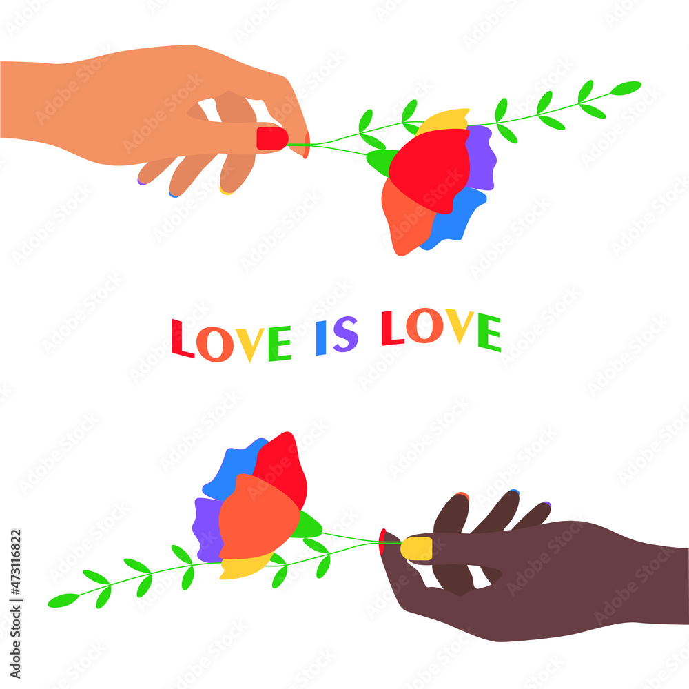 The hands of young girls hold flowers with the flag of the LGBT