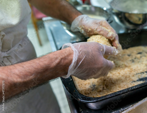 preparation of typical sicilian food called arancino