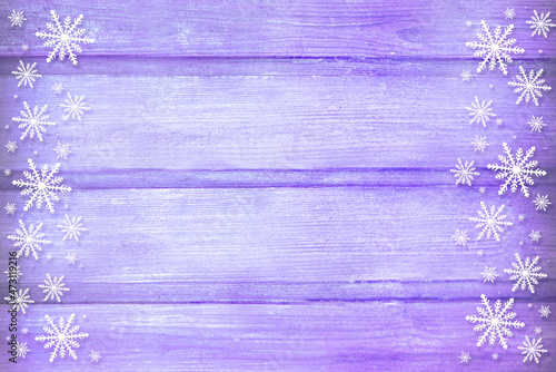 Winter wooden purple lilac violet nature background with snowflakes two sides. Texture of painted wood horizontal boards. Christmas, New Year card with copy space. Can be used for websites, brochures,