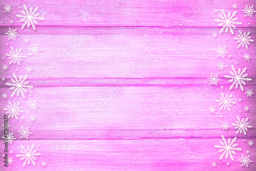 Winter wooden magenta purple mauve nature background with snowflakes two sides. Texture of painted wood horizontal boards. Christmas, New Year card with copy space. Can be used for websites, brochures