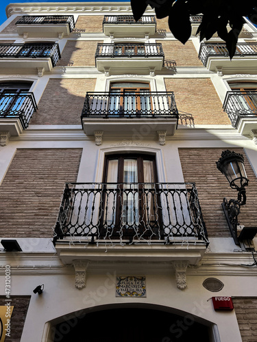 Sunrise light illuminating Valencia's classic facade