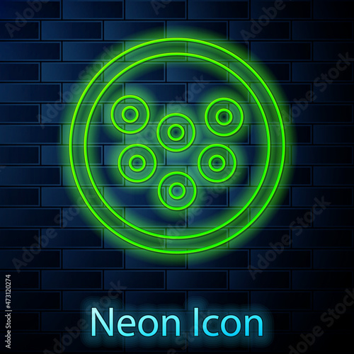 Glowing neon line Caviar on a plate icon isolated on brick wall background. Vector.