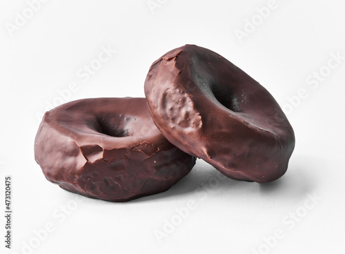  Two delicious chocolate doughnuts isolated on a white background