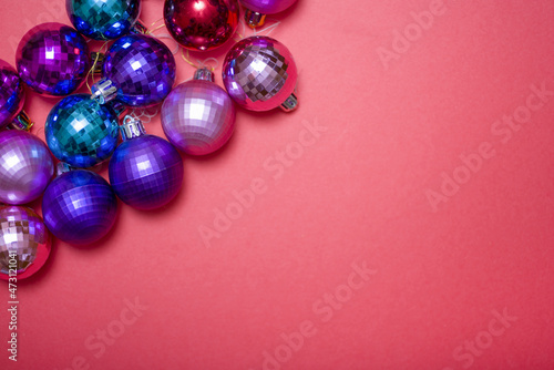 Christmas composition. Christmas red decorations, Christmas tree toys on a red background.