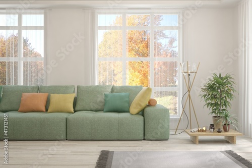 Stylish room in white color with sofa and autumn landscape in window. Scandinavian interior design. 3D illustration