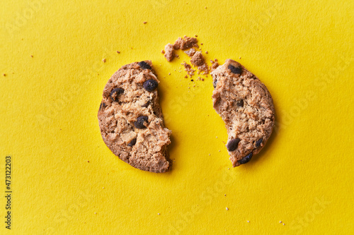  Delicious broken chocolate cookies on a yellow background