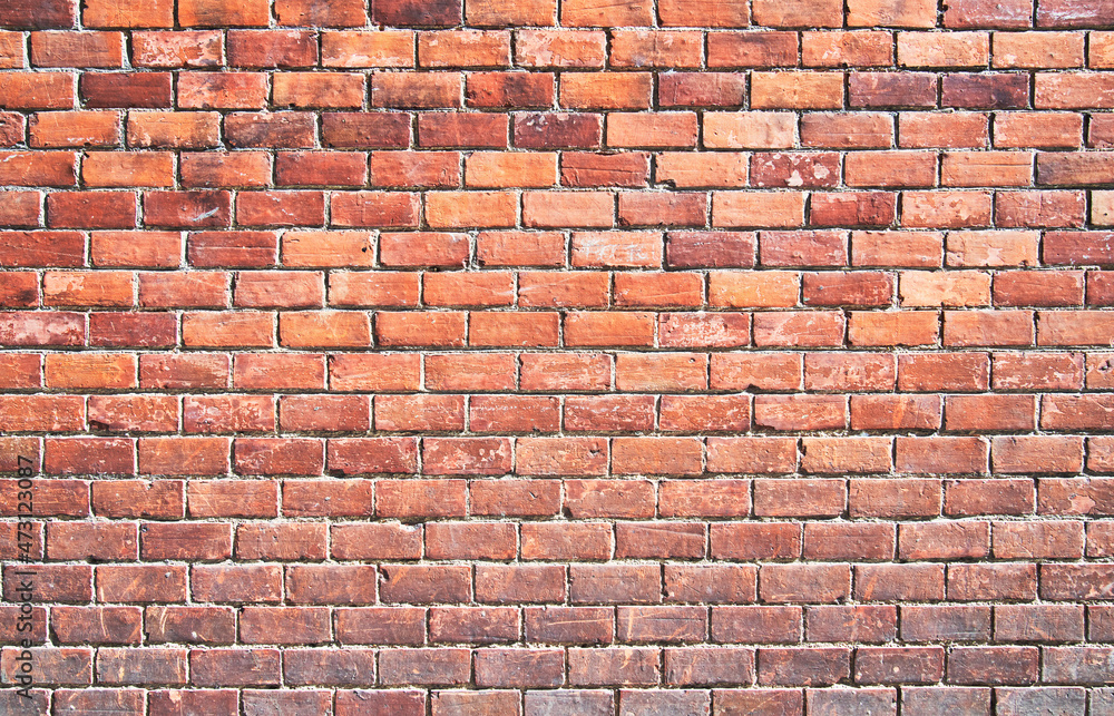 Fototapeta premium Brick wall texture with cracked tiles and cement. Classic brickwall surface background