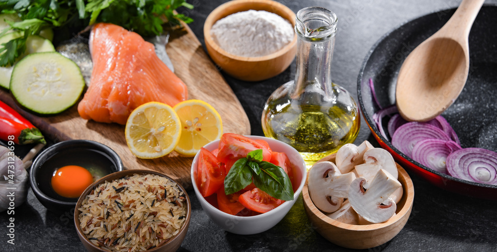 Fresh food ingredients prepared for cooking on a kitchen table Fresh food ingredients prepared for cooking on a kitchen table