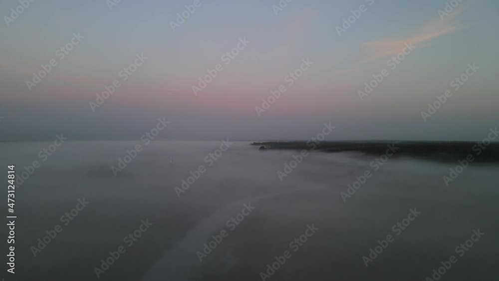 Sunrise in the Narew valley among the morning fog. Sunrise in the Narew valley among the morning fog.