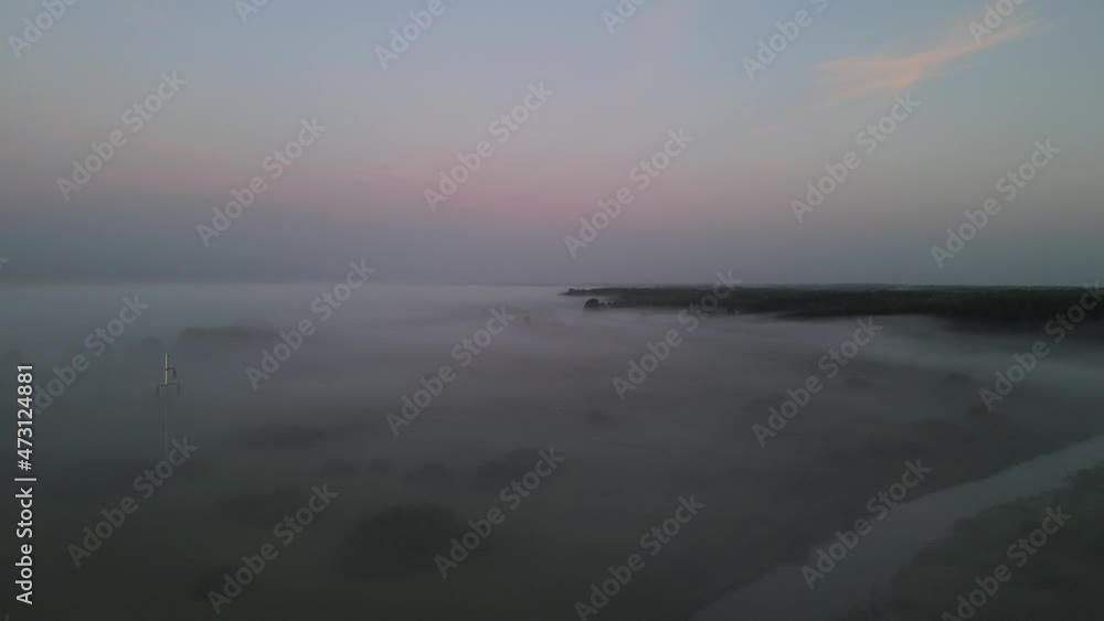 Sunrise in the Narew valley among the morning fog. Sunrise in the Narew valley among the morning fog.