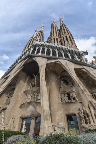 Barcelona, Spain - 22 Nov, 2021: Statues on the exterior of the Sagrada Familia designed by modernista architect Antoni Gaudi. Barcelona