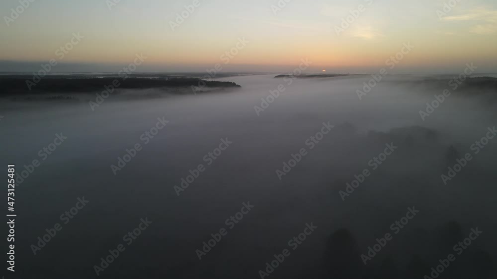 Sunrise in the Narew valley among the morning fog. Sunrise in the Narew valley among the morning fog.