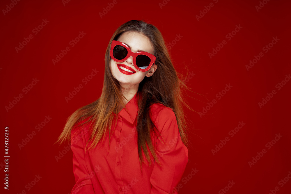 attractive woman in red shirt sunglasses fashion red background attractive woman in red shirt sunglasses fashion red background