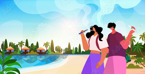 couple smoking e-cigarettes bad habits unhealthy lifestyle nicotine addiction summer vacation concept