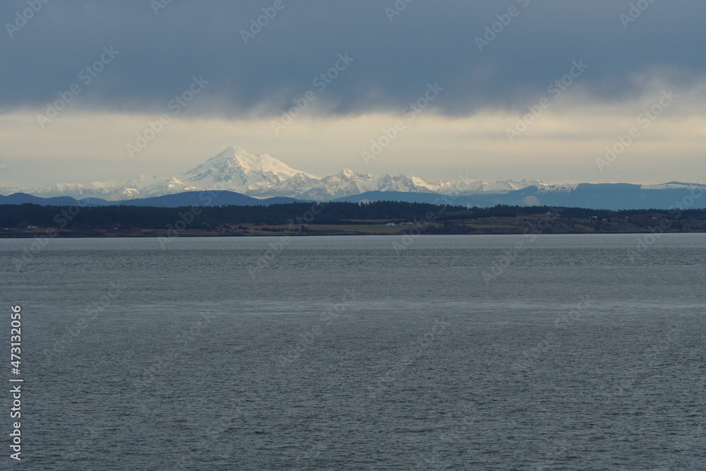 Mount Baker calles as well Koma Kulshan or Kulshan, is active glacier-covered andesitic stratovolcano. It is located in Cascade Volcanic Arc and North Cascades of Washington visible from Salish sea.