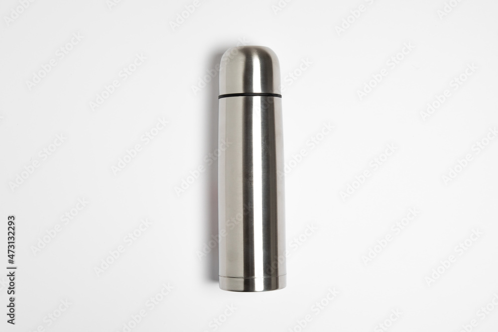 Metal thermos isolated on white background.Thermos flask with cup.High resolution photo.Top view. Mock-up.