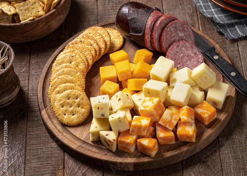 Canvas Print Cheese platter with crackers and sausage