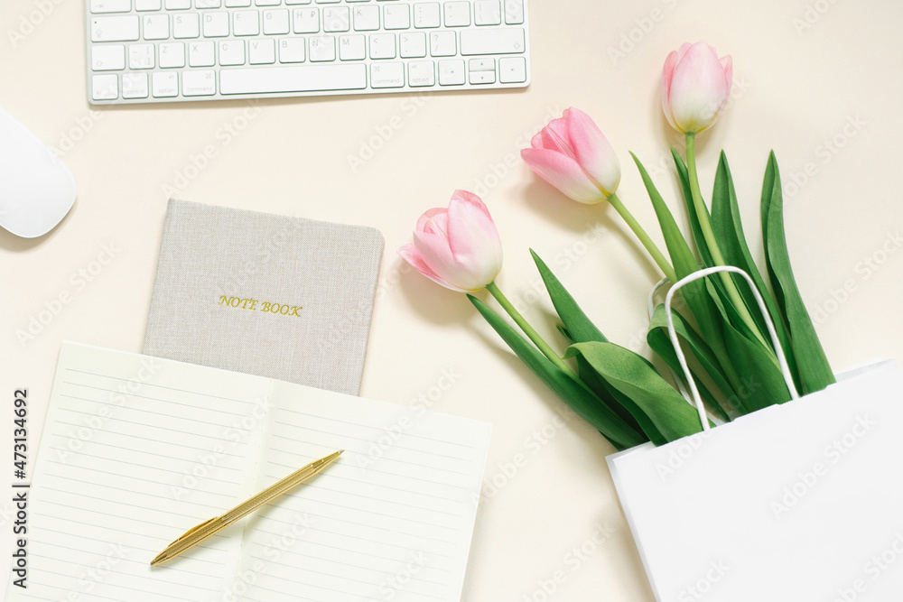 Tulips, gift box and coffee on a beige background. Flat lay. 8 March, International Women's Day. Valentine's Day. Blogger's workplace Tulips, gift box and coffee on a beige background. Flat lay. 8 March, International Women's Day. Valentine's Day. Blogger's workplace