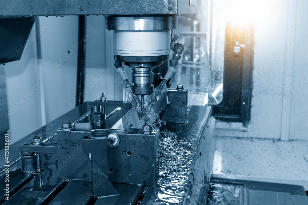 The CNC milling machine cutting the mold parts with oil coolant method. The CNC milling machine cutting the mold parts with oil coolant method.
