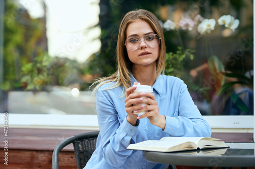 Business woman in a cafe outdoors fresh air summer