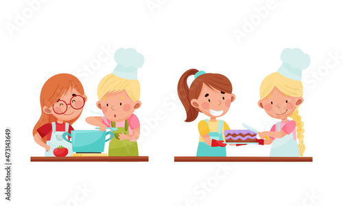 Cute kid chef characters set. Adorable cheerful children preparing tasty dishes cartoon vector illustration