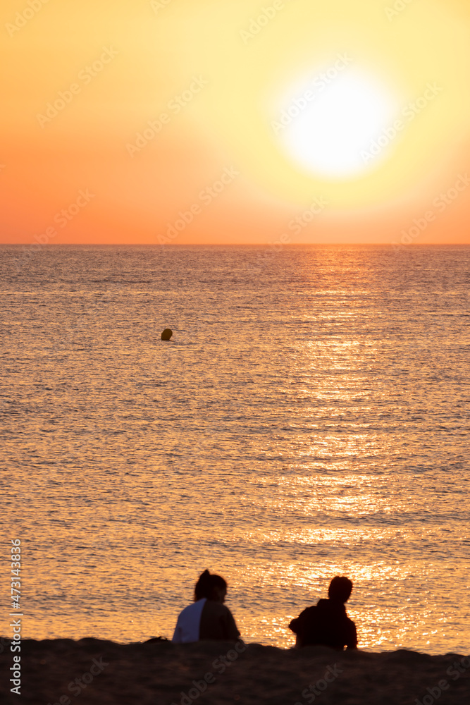 young couple on the beach at sunrise in pals beach