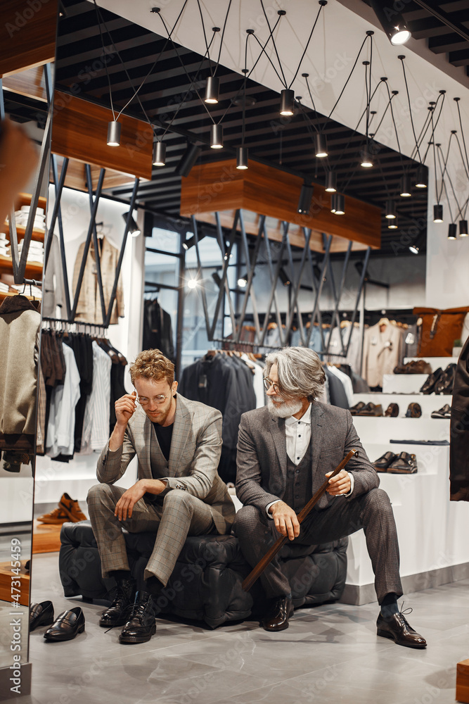 Senior man choosing a new suit in a store