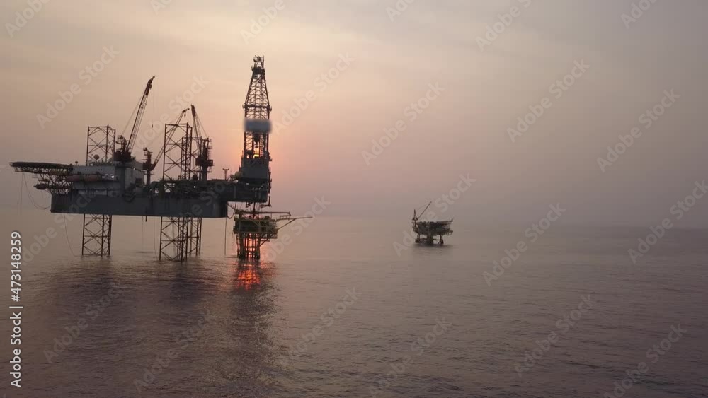 Aerial view from a drone of an offshore jack up rig at the offshore location during sunrise time
Aerial view from a drone of an offshore jack up rig at the offshore location during sunrise time