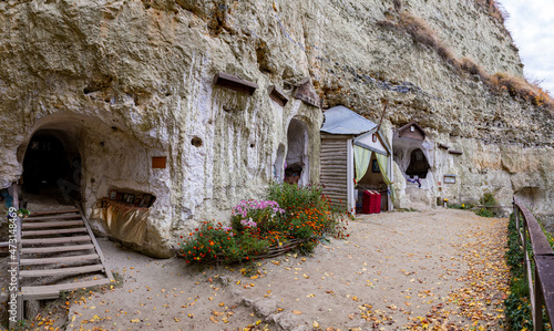 Cave monastery on Bakota over the Dniester river in autumn day. photo