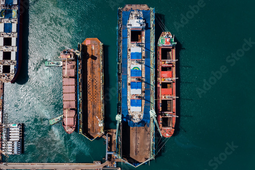 oil tank ship repairing and maintenance on shipyard dock in sea aerial top view