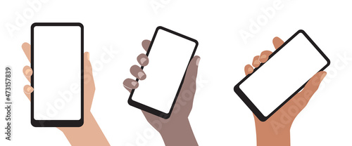 A smartphone in a human hand. A mobile phone with an empty screen is held by a human hand