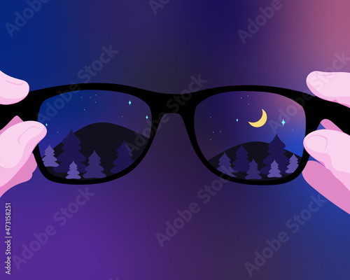 Looking through glasses at night with mountain landscape