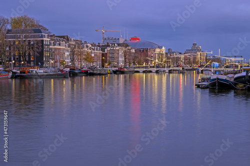 City scenic from Amsterdam at the river Amstel in the Netherlands at sunset © Nataraj