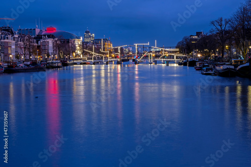 City scenic from Amsterdam at the river Amstel in the Netherlands at sunset © Nataraj