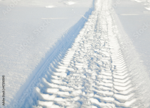 Wheel tracks on the snow. © rootstocks