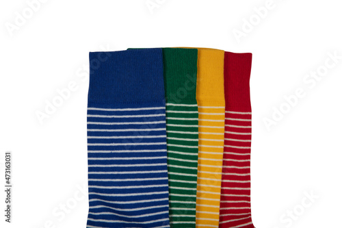 Flat socks.Long sock, elastic colorful fabric and striped Xmas warm ankle or sport feet cotton or wool comfort clothes. Socks are scattered on a bright background. Socks of different types and sizes.