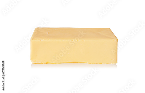 Piece of butter isolated on a white background.
