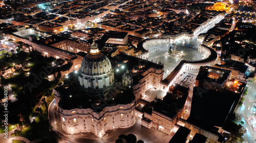 Photography Aerial drone night shot of iconic masterpiece Saint Peter Basilica and whole ill