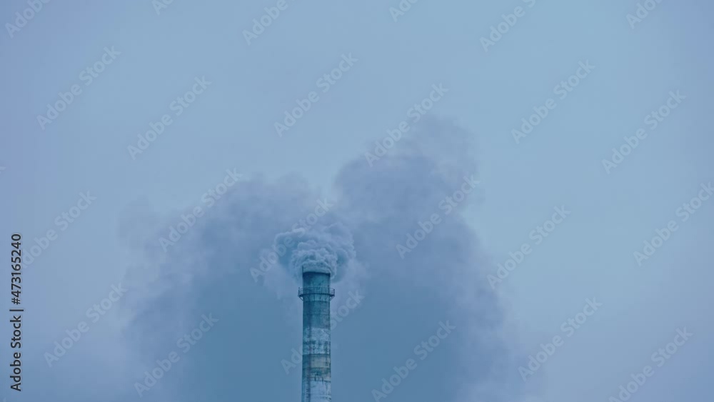 This smoke coming from the chimney in a factory. Harmful emissions into the atmosphere, from the pipe. Serious damage the environment.