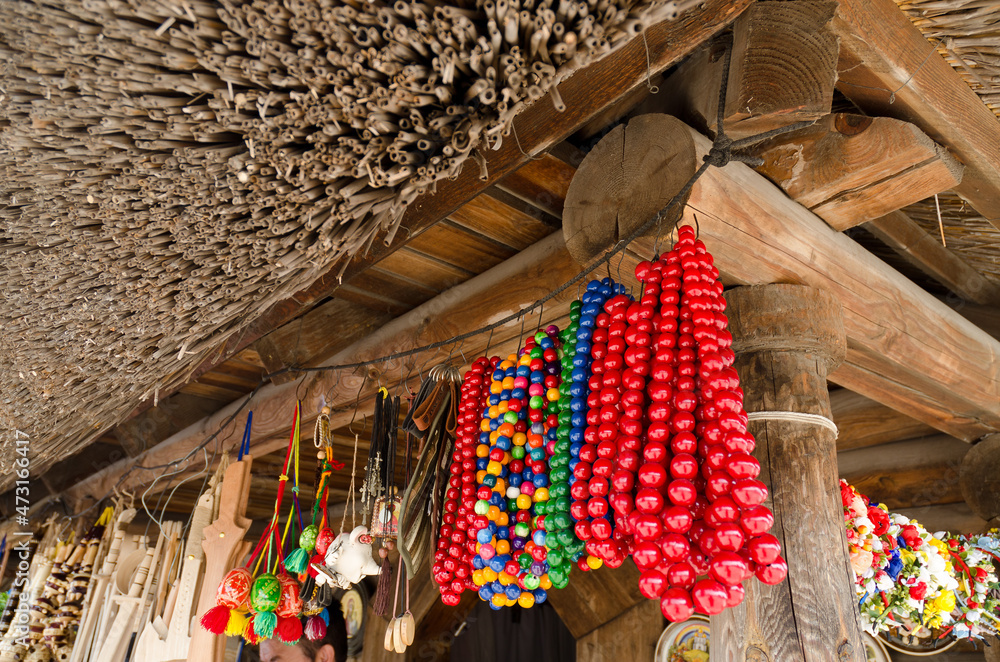 Fair for handmade products. Ethnic head hoops made of colorful flowers and textile. Beads. Market. Crafts. 