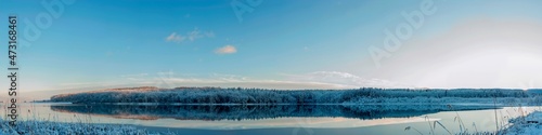 Panorama of winter lake with fog and forest © mikhailgrytsiv
