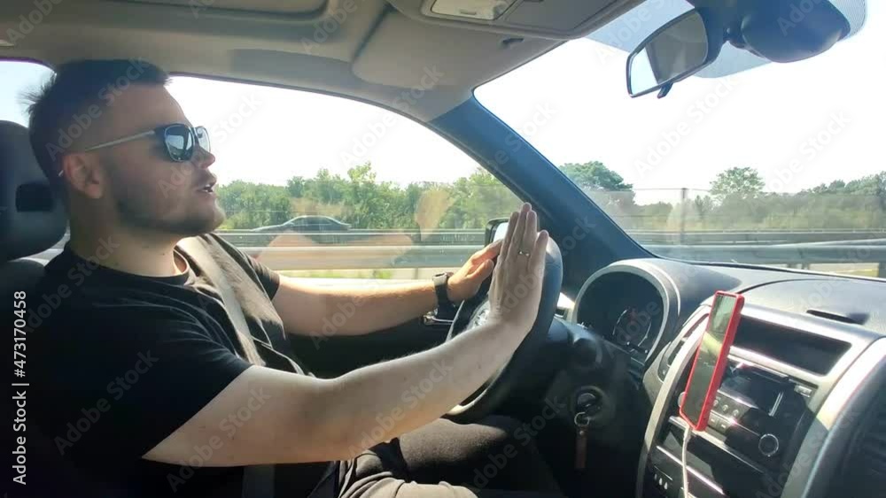 man driving car and singing man driving car and singing