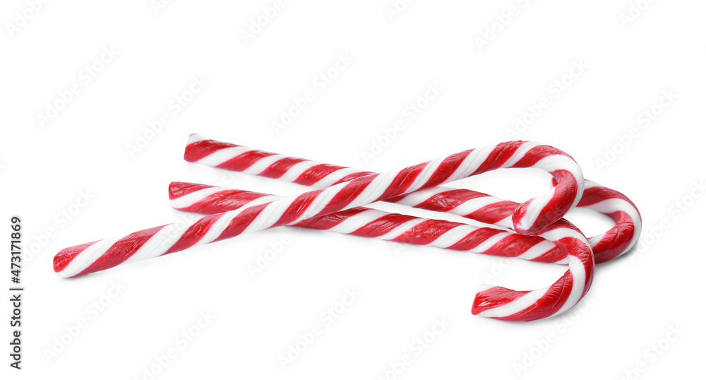 Obraz premium Delicious Christmas candy canes on white background
