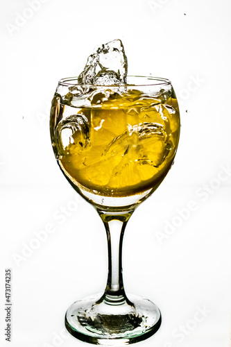 Lemon splashes in a water glass