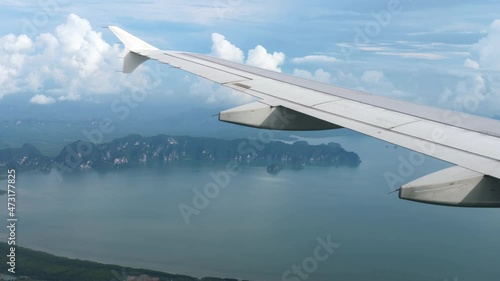 Airliner flies over the ocean photo