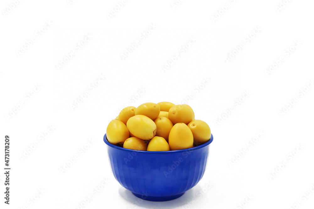 Raw dates palm-yellow dates isolated on white background Raw dates palm-yellow dates isolated on white background