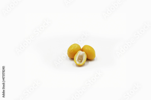 Raw dates palm-yellow dates isolated on white background