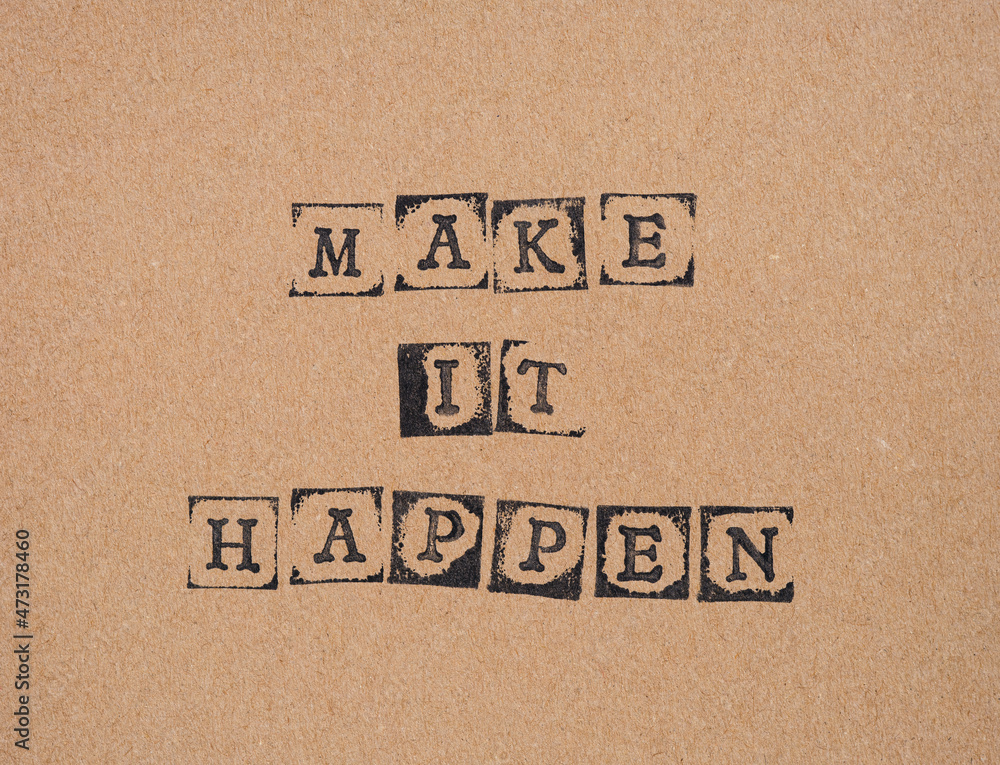 Cardboard with words Make It Happen