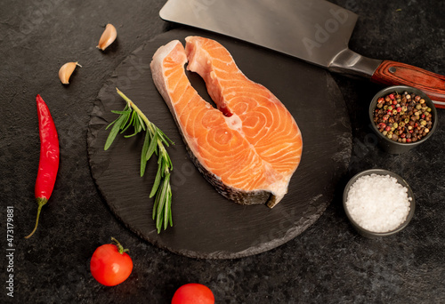 raw salmon steak on stone background 