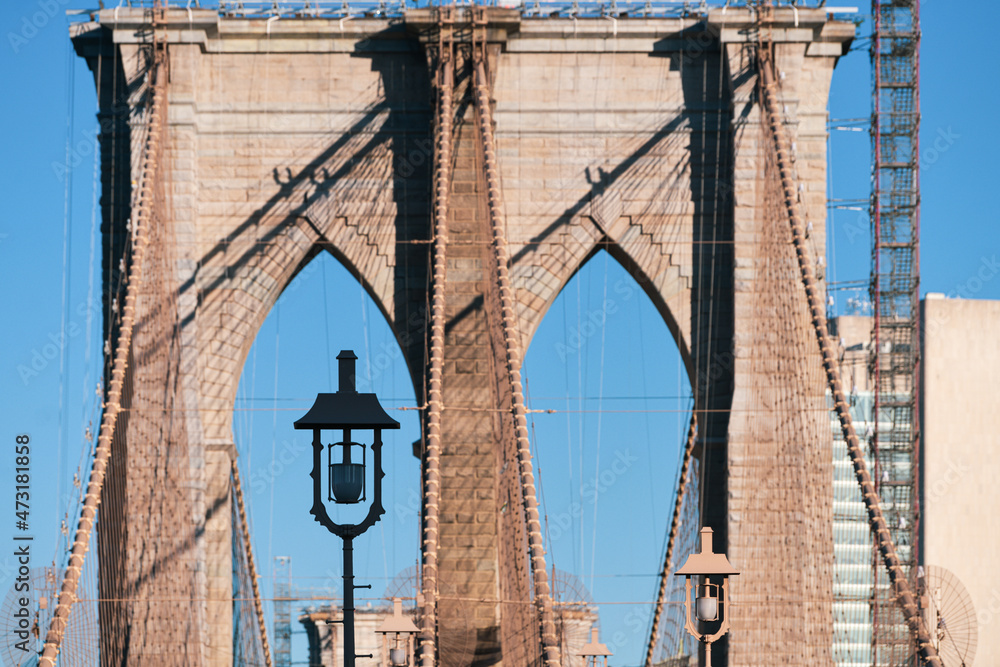 Fototapeta premium Details of the hybrid cable-stayed suspension Brooklyn Bridge, built in 1883, the first crossing the East River from Manhattan in New York, America. Amazing construction and impressive elements.